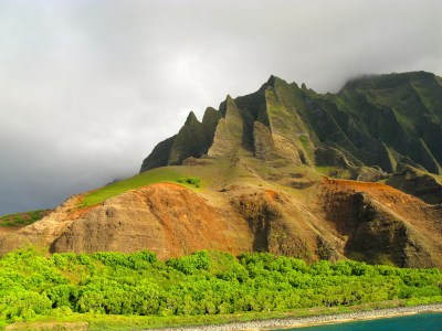 a body of water with a mountain in the background