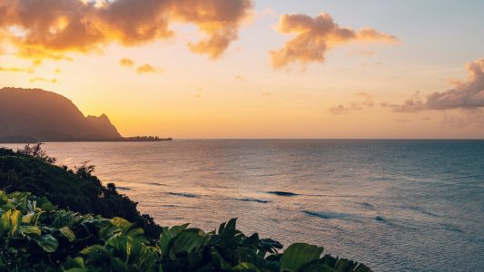 a sunset over a body of water