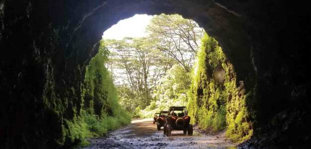 a truck traveling down a dirt road